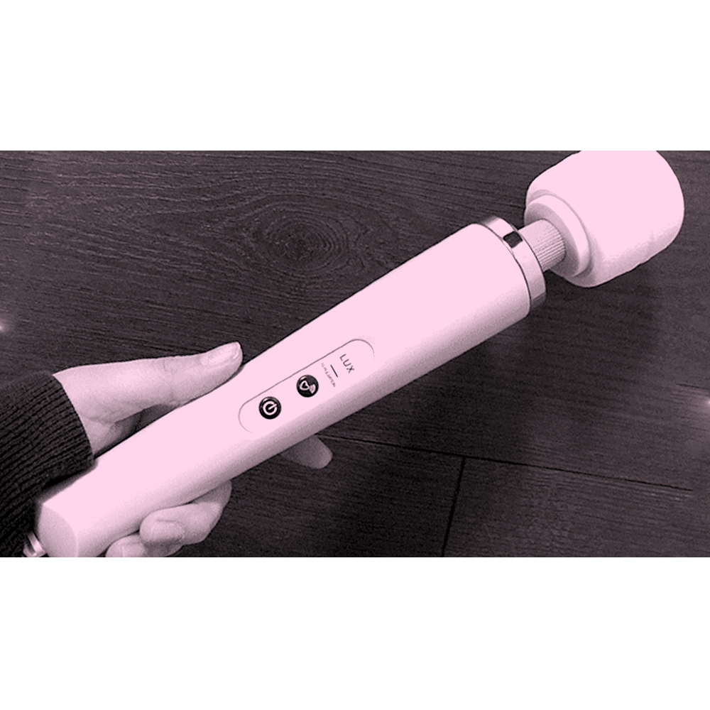 Image of massage wand being held in hand