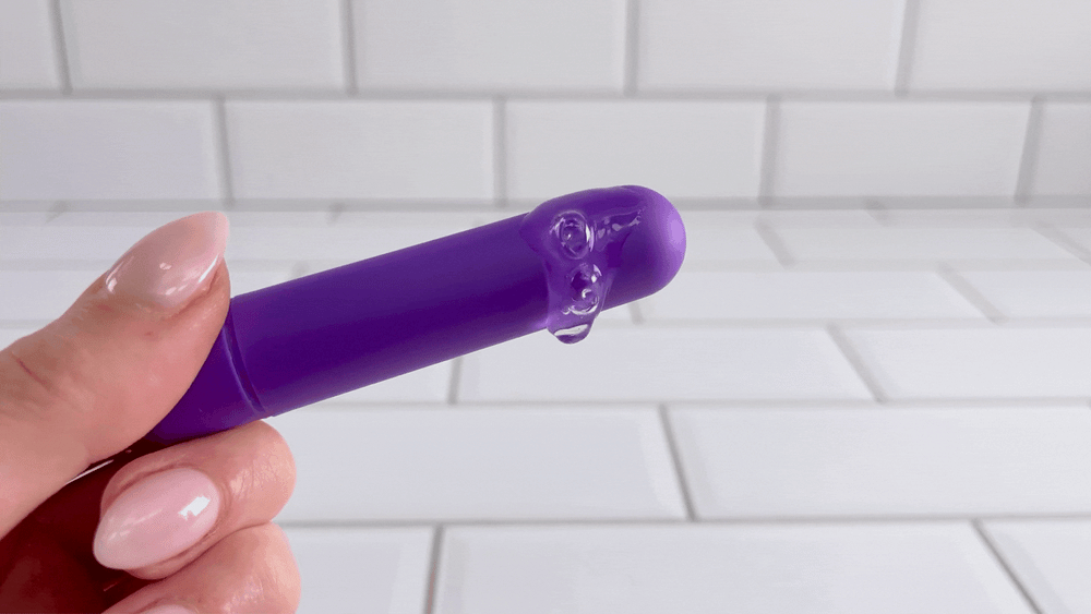 GIF of lube vibrating off of purple Cutey Vibe Plus