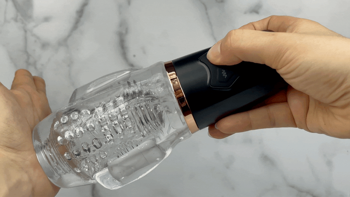 GIF showcasing suction power of masturbator on a hand