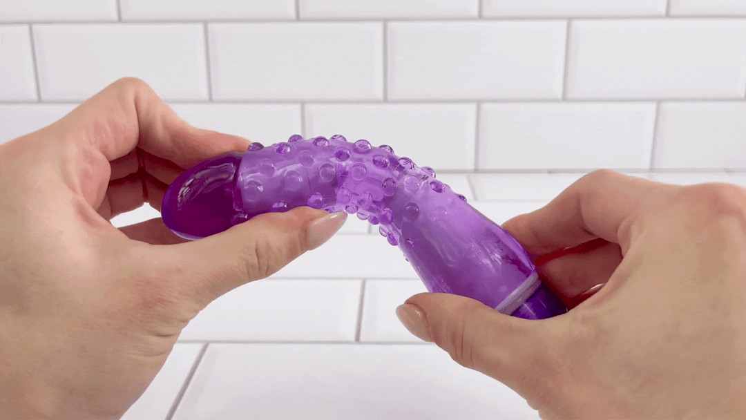GIF of Nubby Waterproof Vibrator for Beginners shaft being bent to demonstrate flexibility