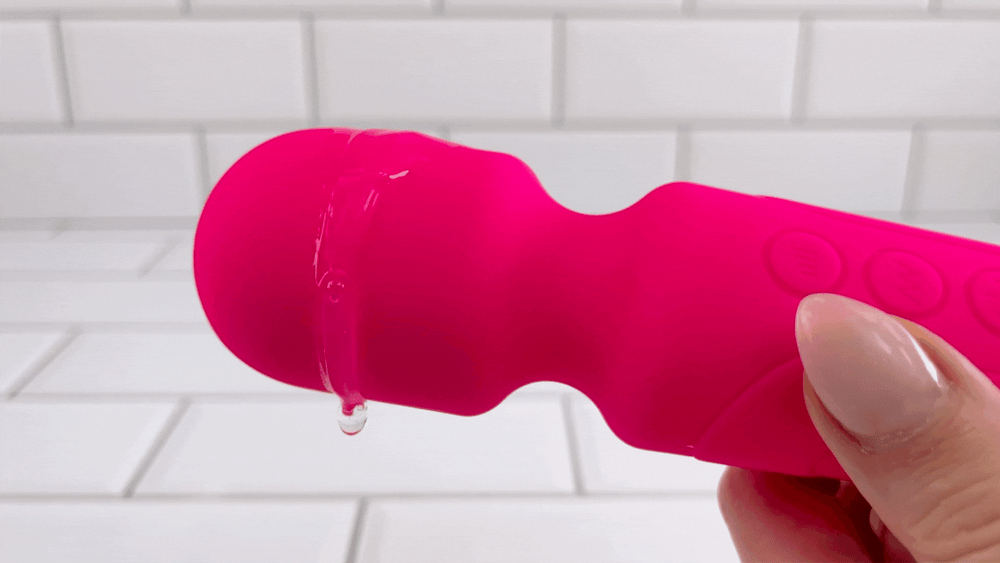 GIF of Silicone Power Wand Massager with lube vibrating off of it
