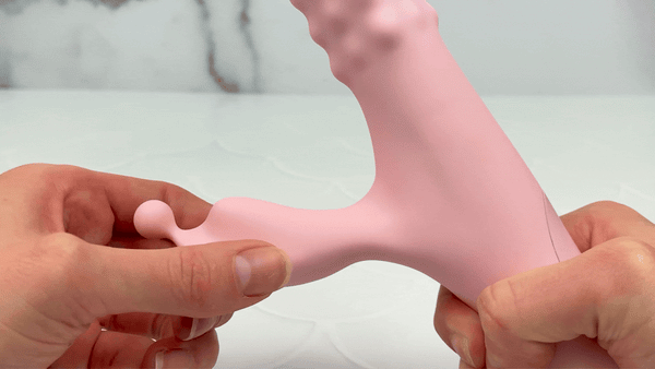 GIF of pink pearl vibrator bunny being bent to show flexibility