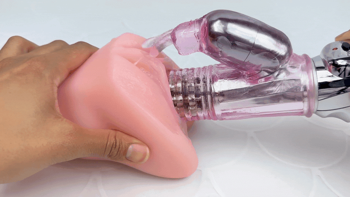GIF of rabbit thrusting in and out of a model of a vagina