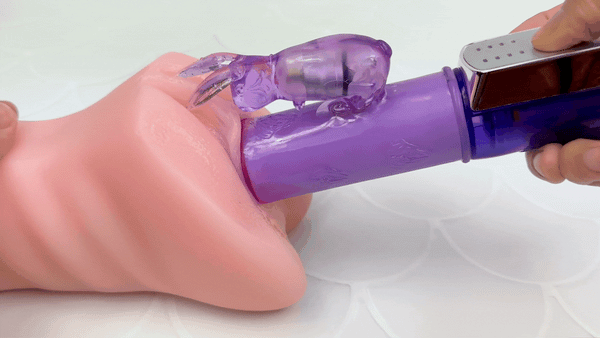 GIF of purple thrusting rabbit vibrator inside realistic male masturbator