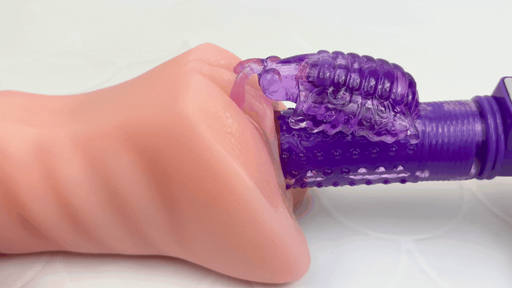 GIF of dual-action vibe thrusting in and out of a model of a vagina