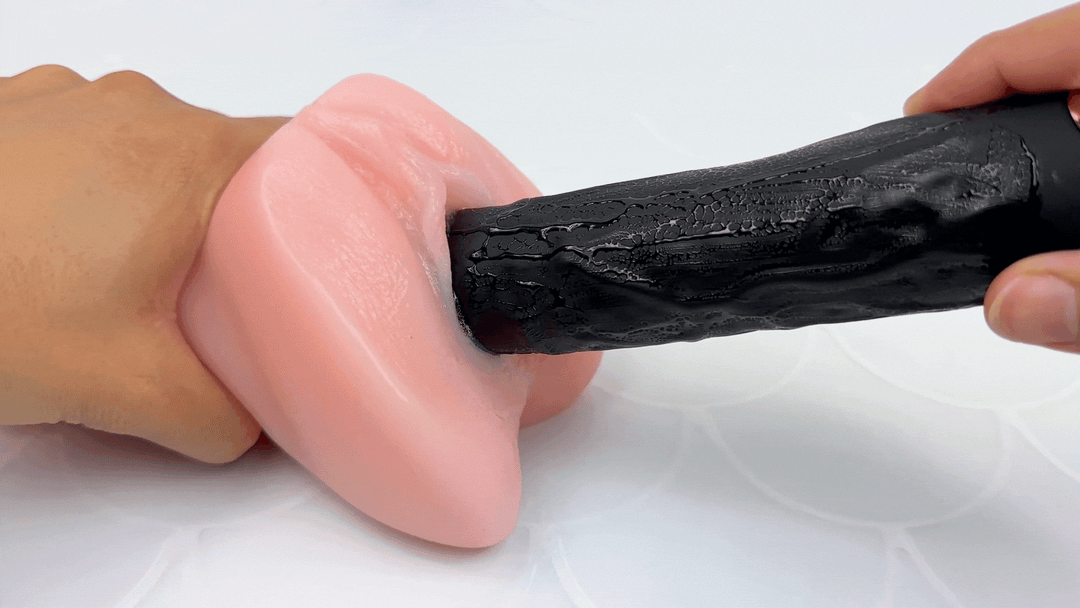 GIF of dildo vibrating inside of a model of a vagina