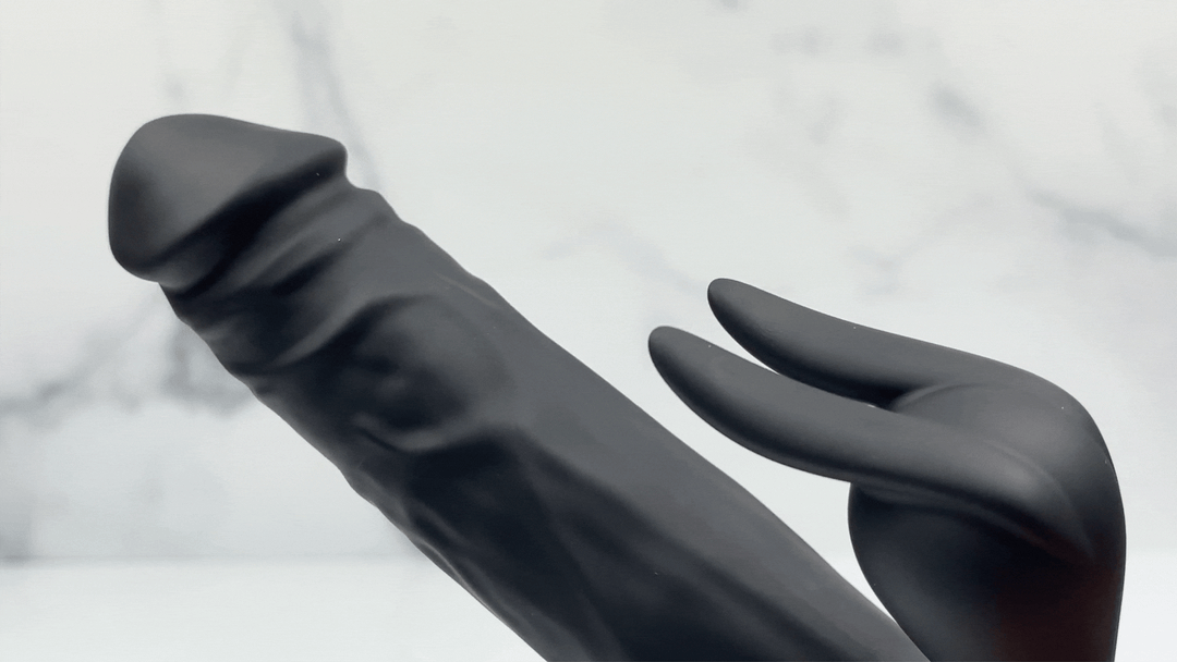 GIF of black Bato Plus adult toy thrusting and vibrating rabbit