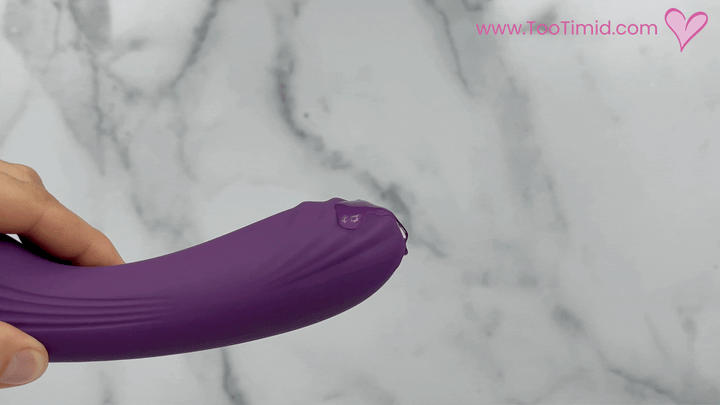 GIF of close-up of massager end of toy with lube on it and vibrating