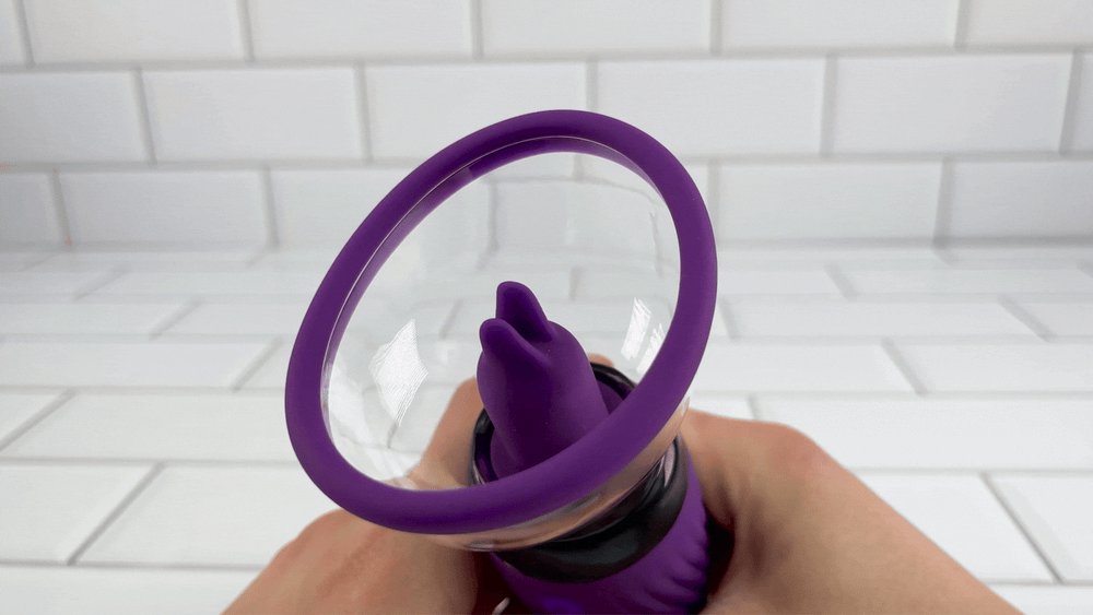 GIF of purple Arouse Clit Pump Teaser twirling at fast pace
