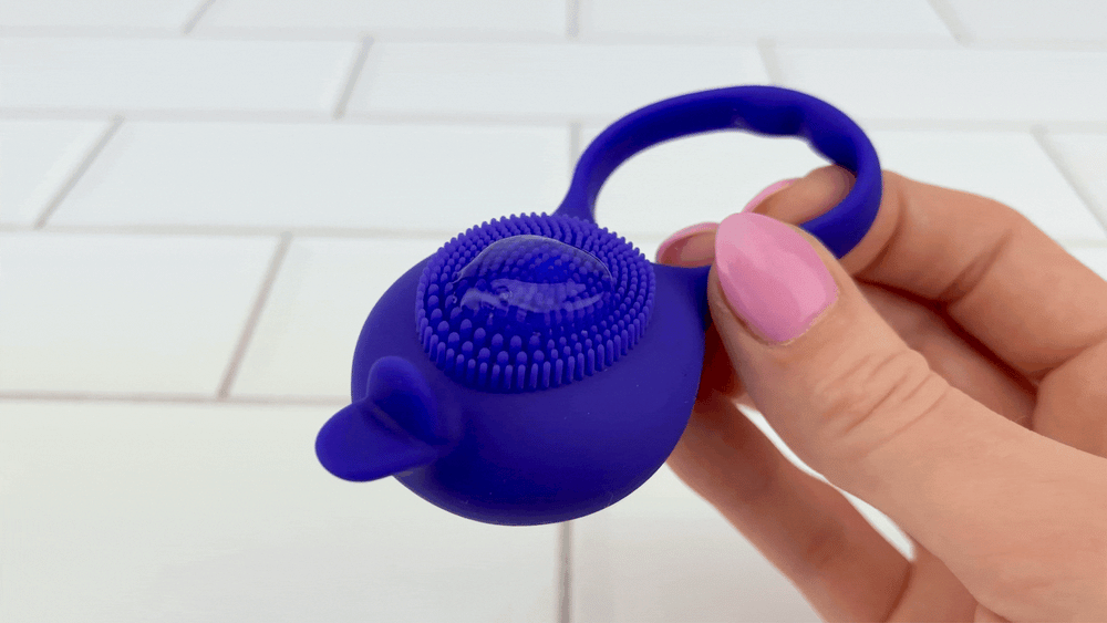 GIF of lube vibrating on bristles of Silicone Clit Stimulating Vibrating Cock Ring For Couples