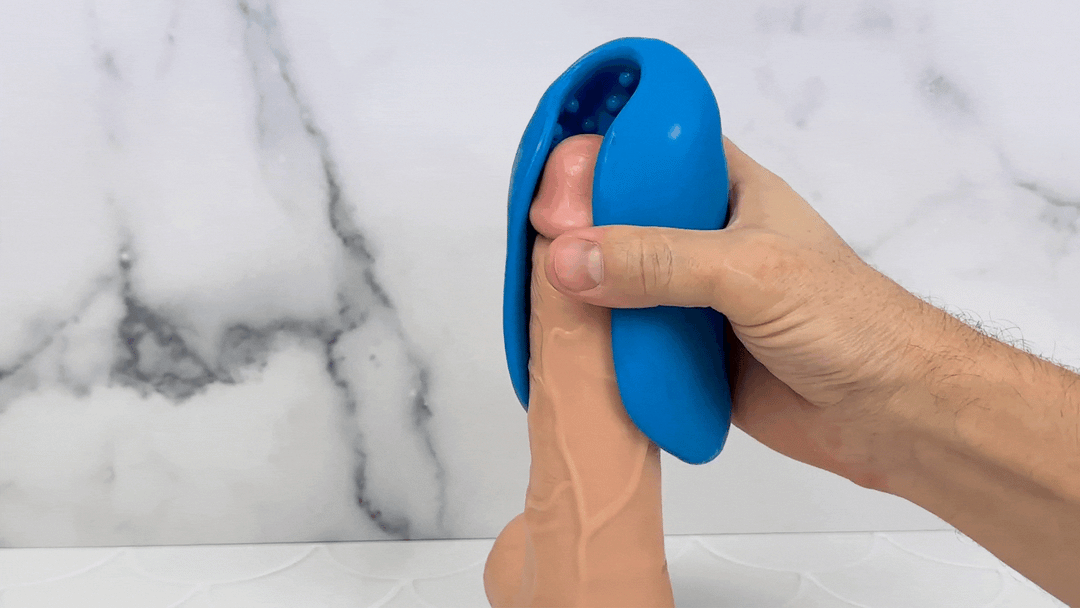 GIF of stroker being used on a model of a penis