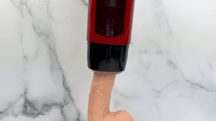 GIF of sucking masturbator being used on a dildo