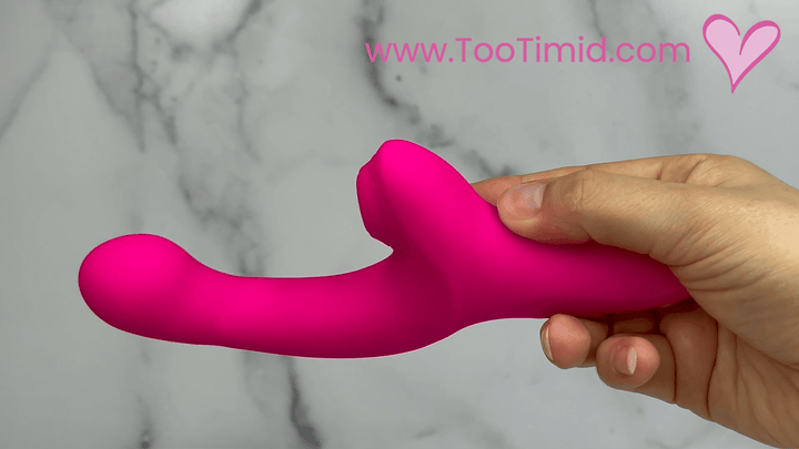 GIF of duel pink vibrator showcasing fingering from side view
