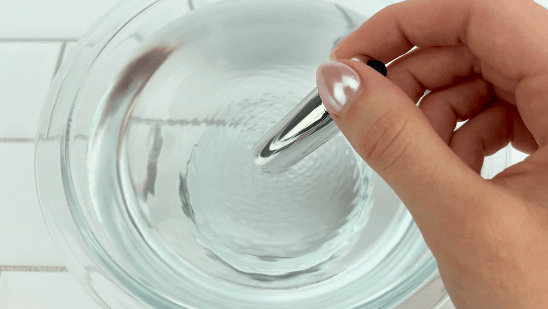 GIF Beaded Double Penetration Clit Stimulating Vibrating Cock Ring bullet vibrating in bowl of water