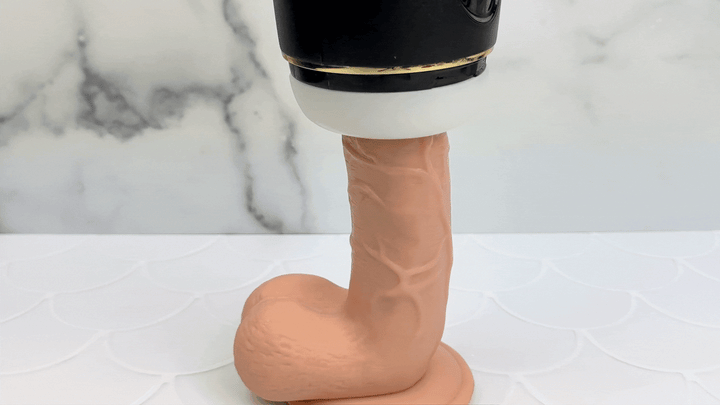GIF of masturbator suction function being used on a dildo