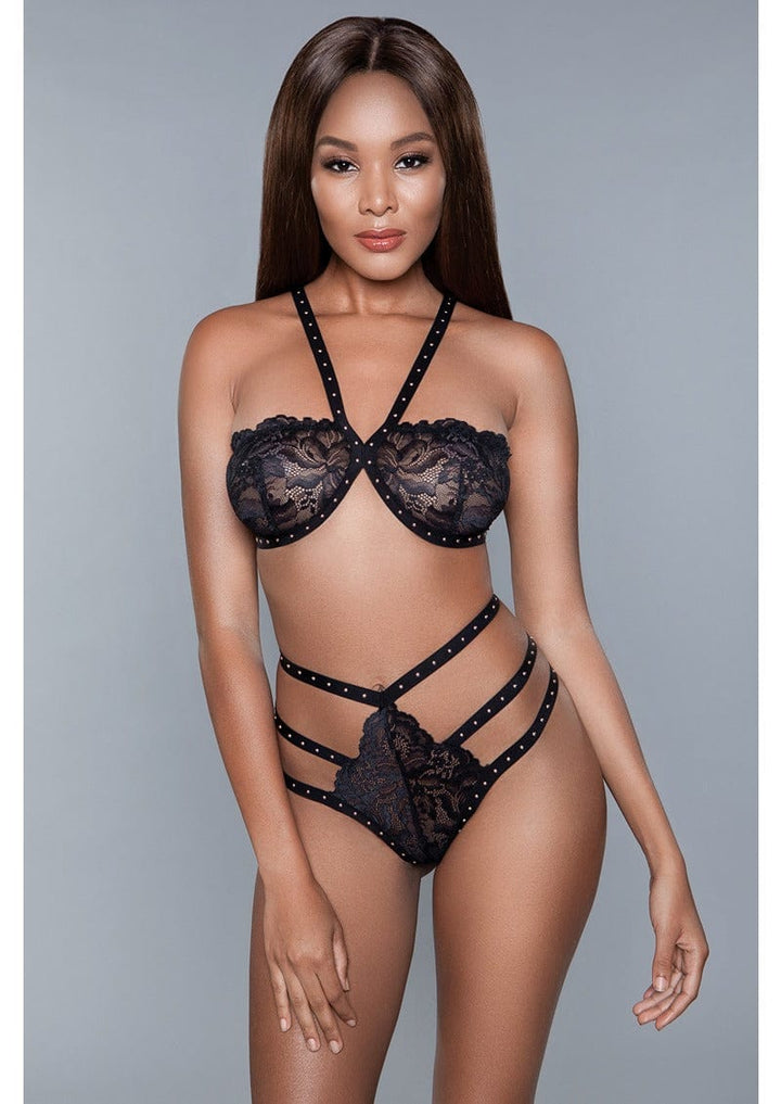 2 Piece. Lace cup wireless bra, with studs along the straps and high-waisted crotchless g-string panty facing forward