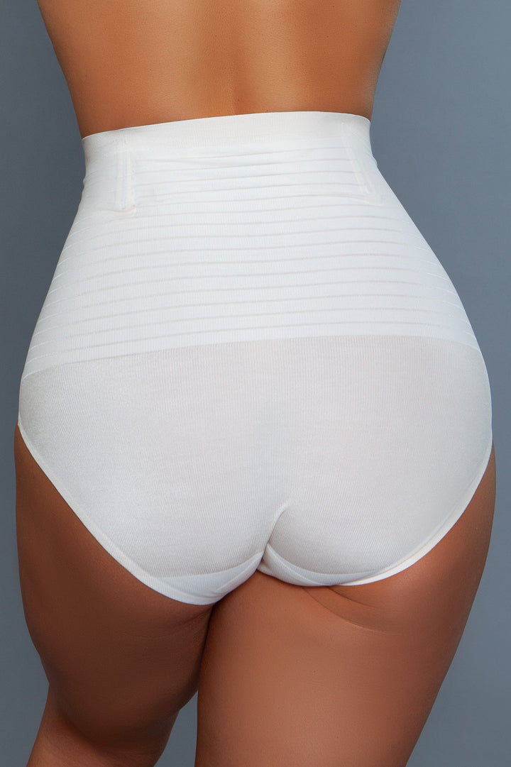 Model wearing seamless high-waisted tummy control body shaper with waist boning in white facing back close up