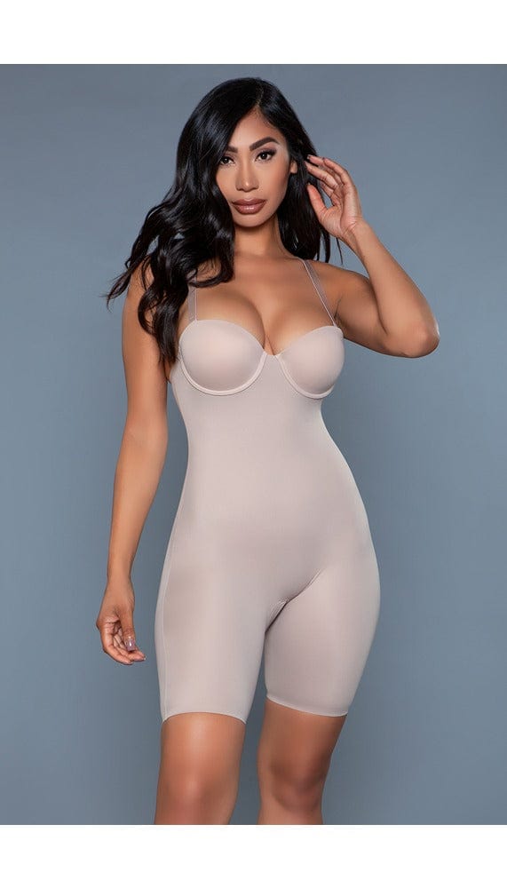 Model wearing bodyshaper with underwiring bra, adjustable straps, and open crotch in beige facing forward
