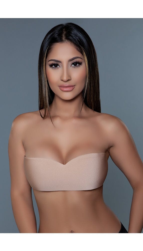 Tan nude color wing-shaped and backless adhesive bra.