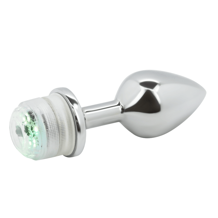 Image of the anal plug turned slightly to the side, with the green light on.