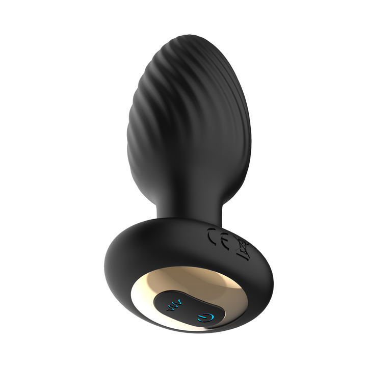 rotating anal plug from a lower left angle showing texture on bulb and controls on bottom