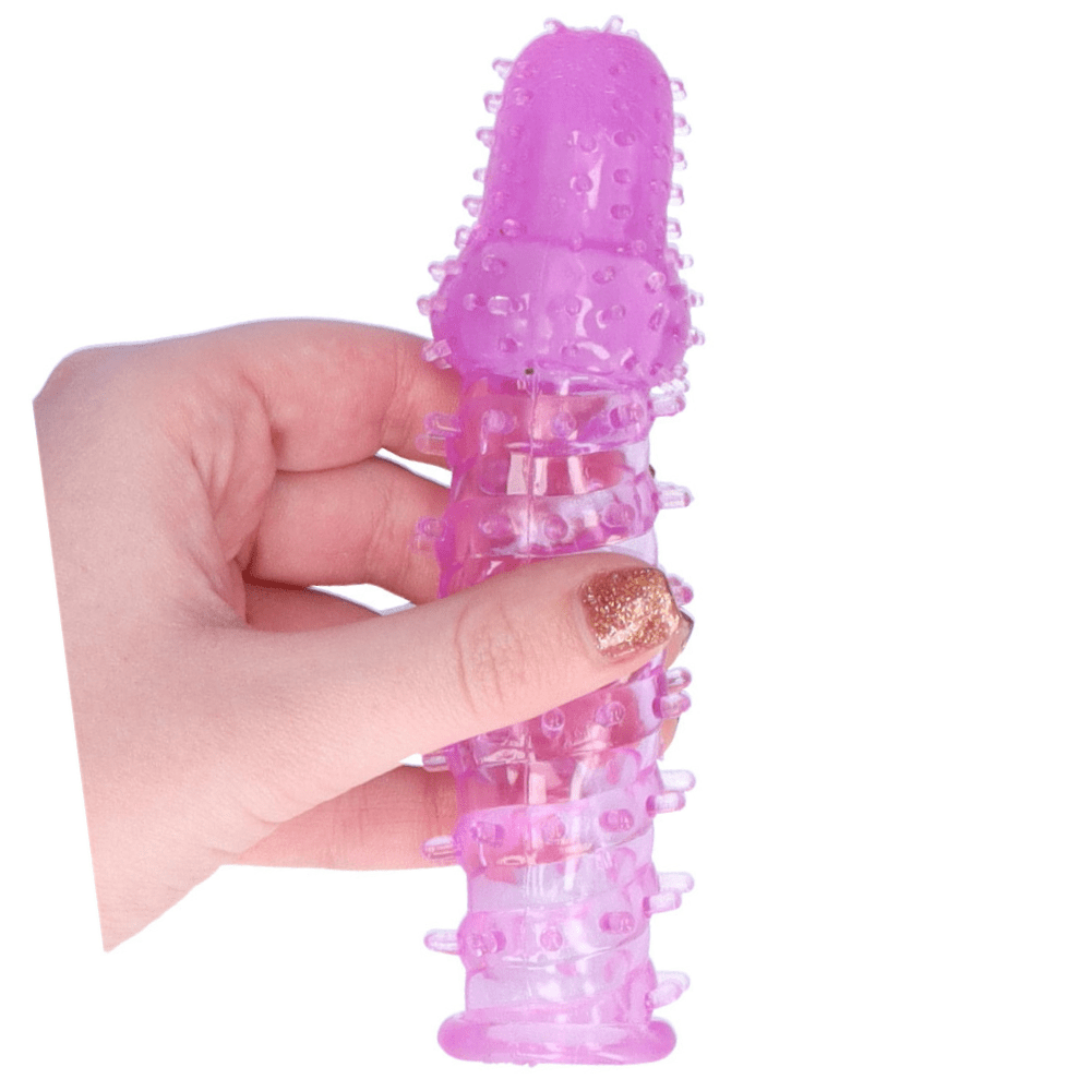 Jelly penis extender held in hand.