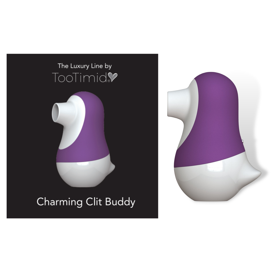 Photo of the clit buddy next to its packaging.