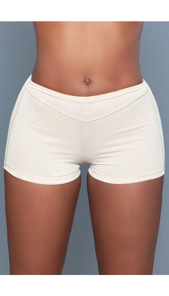Model wearing butt booster boyshort with rear round openings for a natural lift in beige facing forward