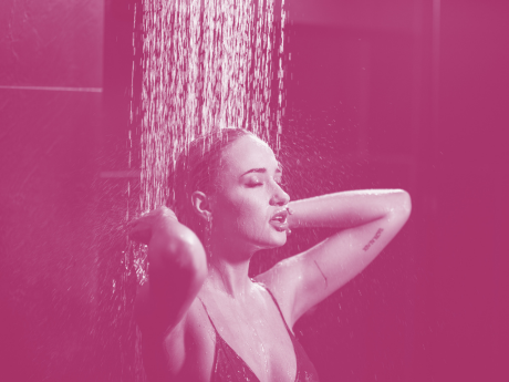 woman wearing black bikini top in the shower 