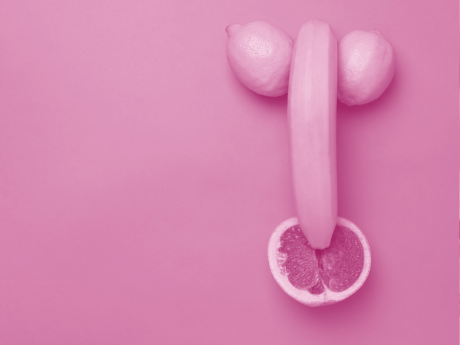 banana and two lemons nudging against grapefruit