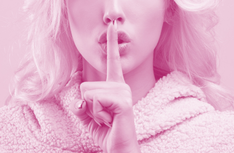 Attractive blond woman quiet shush mouth 