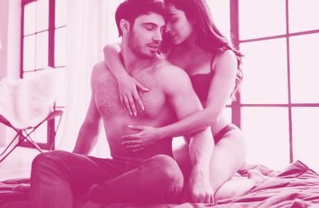 woman straddling man from behind in bed 