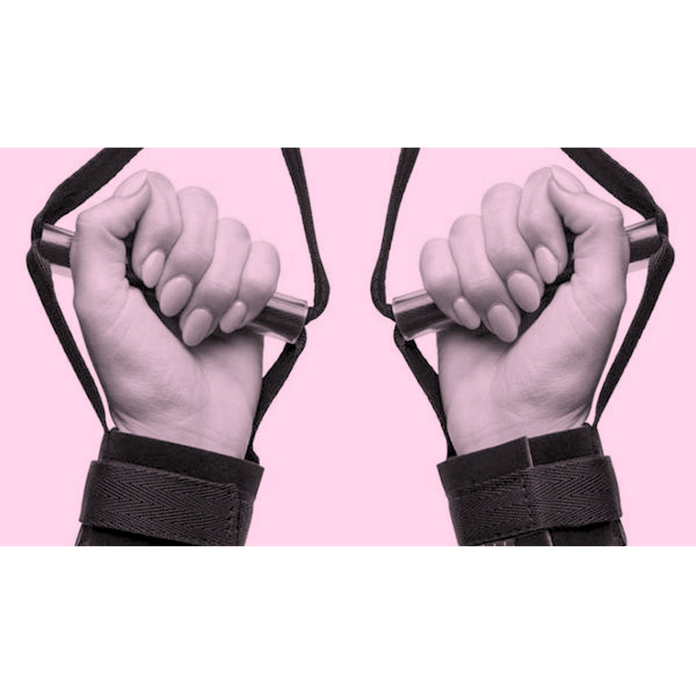Image of hands holding bondage restraint system