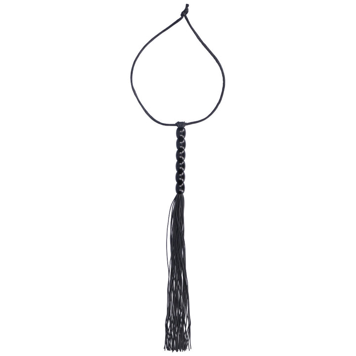 Black flogger with black beaded handle.