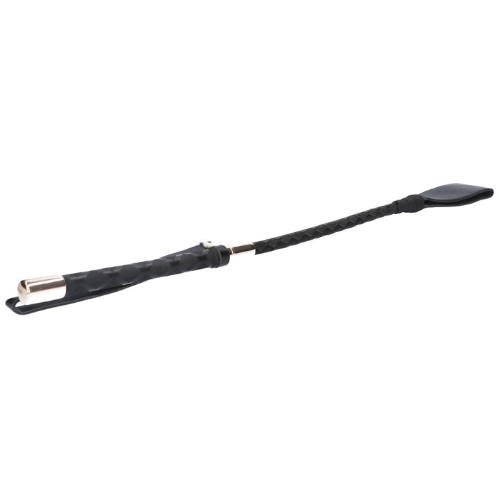 Side view of black riding crop.