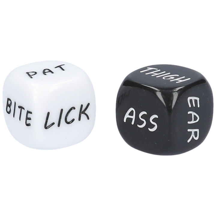 A pair of black and white foreplay dice with instructions on each face of one die and body parts on each face of the other die.