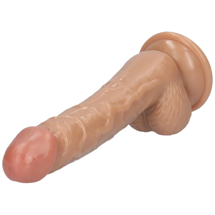 Angled side view of beige suction cup dildo.