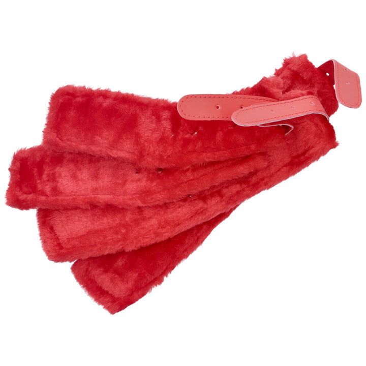 Bird's eye view of inside of 4 red adjustable cuffs with soft fur lining.