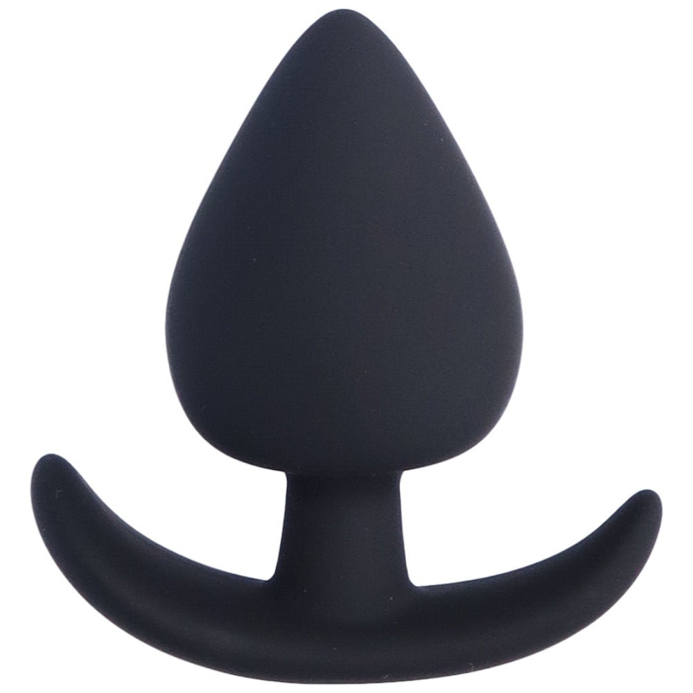 Bird's eye view of small black silicone anal plug with a tapered tip and flared base.