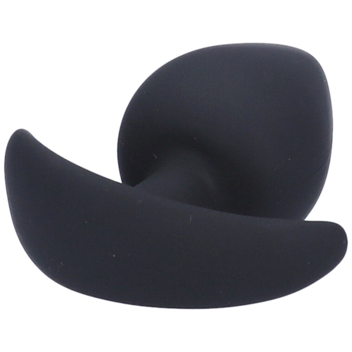 Bottom view of small black silicone anal plug with a tapered tip and flared base.