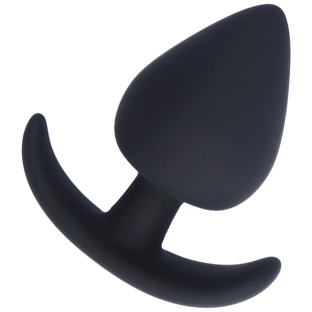 Bird's eye view of large black silicone anal plug with a tapered tip and flared base.