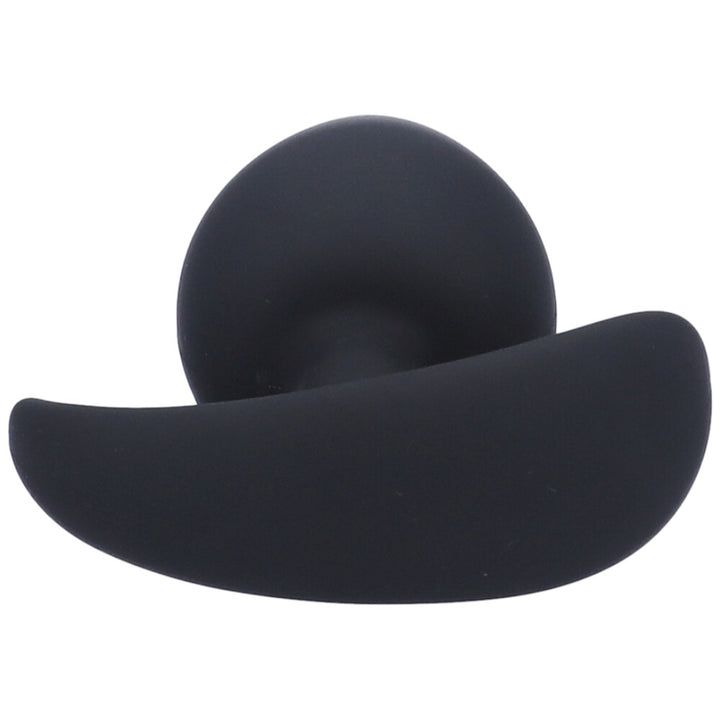 Bottom view of large black silicone anal plug with a tapered tip and flared base.