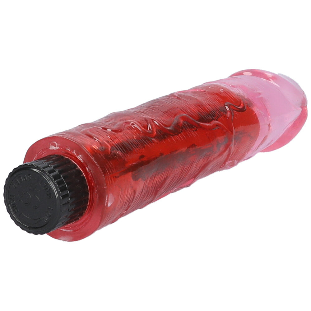 Pink 8" vibrating dildo lying on its side with detailed view of raised veins on the shaft.