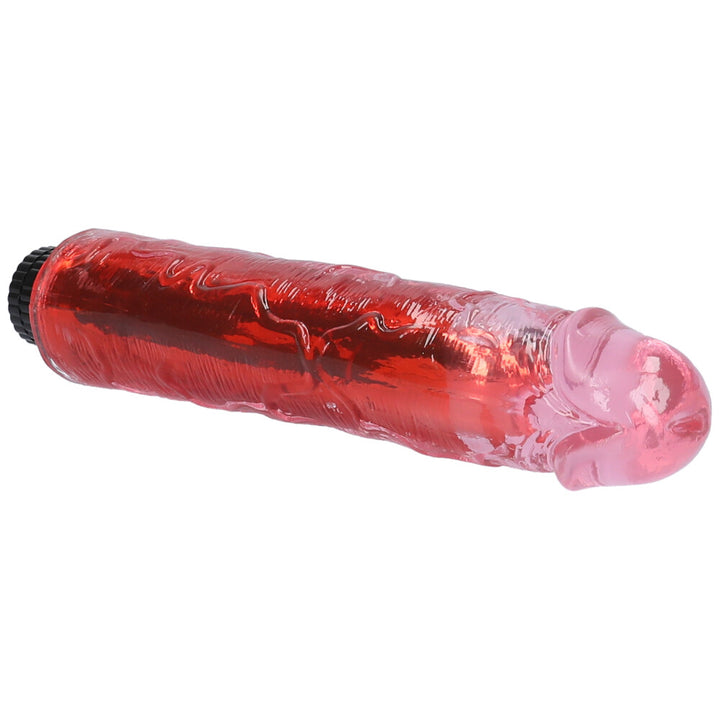 Close-up view of pink 8" vibrating dildo's tip and veiny shaft.
