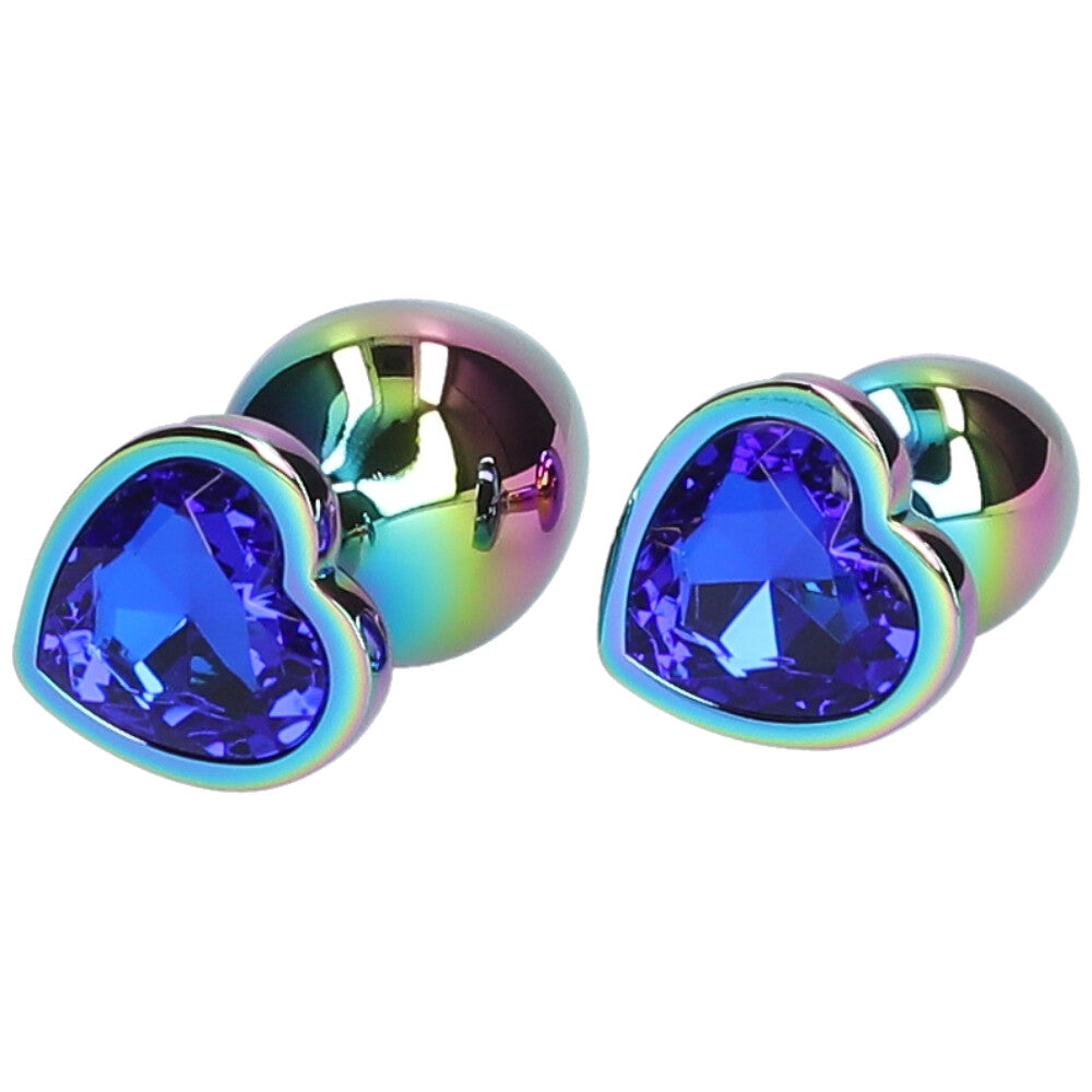 Bottom view of blue  jeweled metal rainbow butt plugs lying next to eachother.