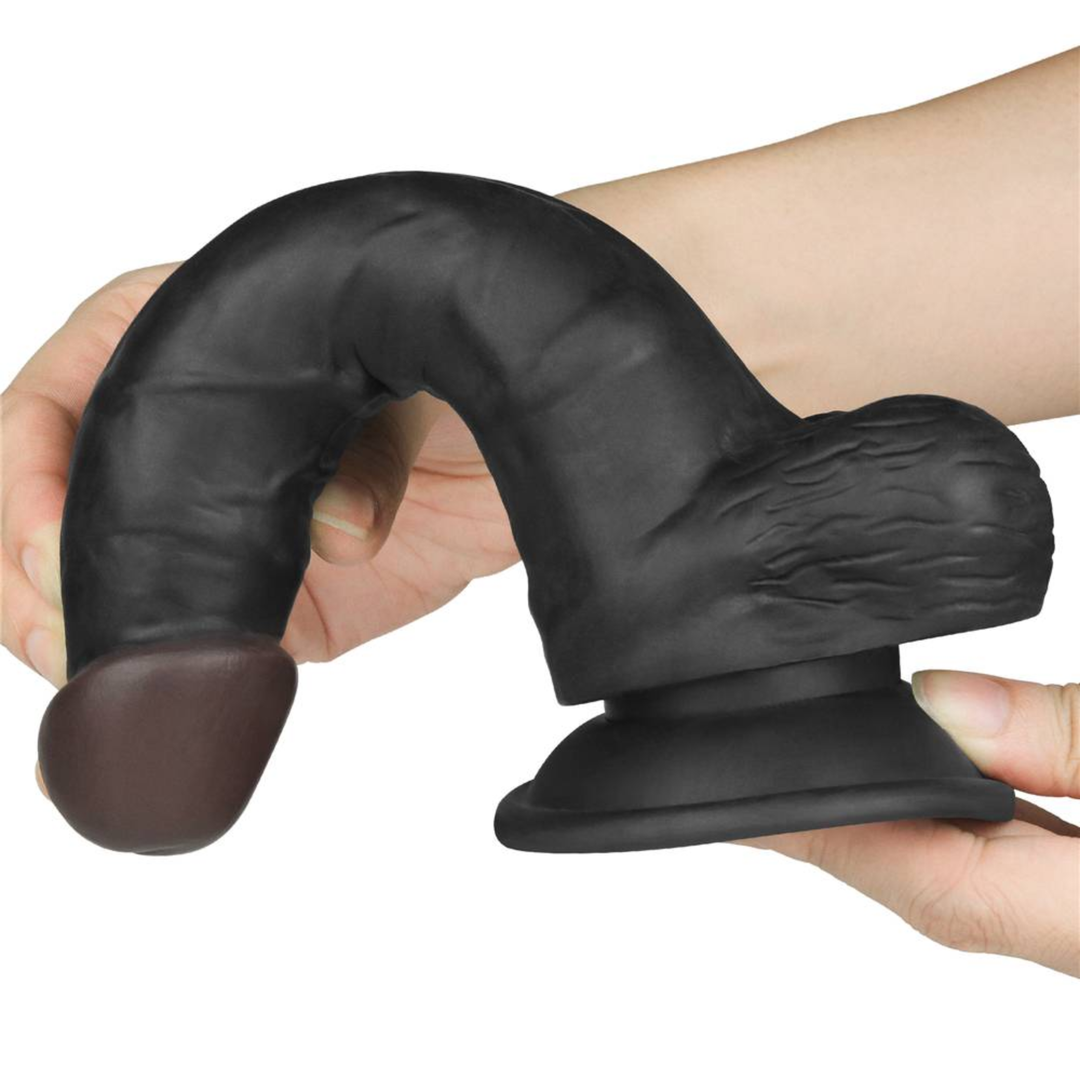 hand bending dildo from INGEN 7.5 Inch Black Easy Strapon Set  to show flexibility 