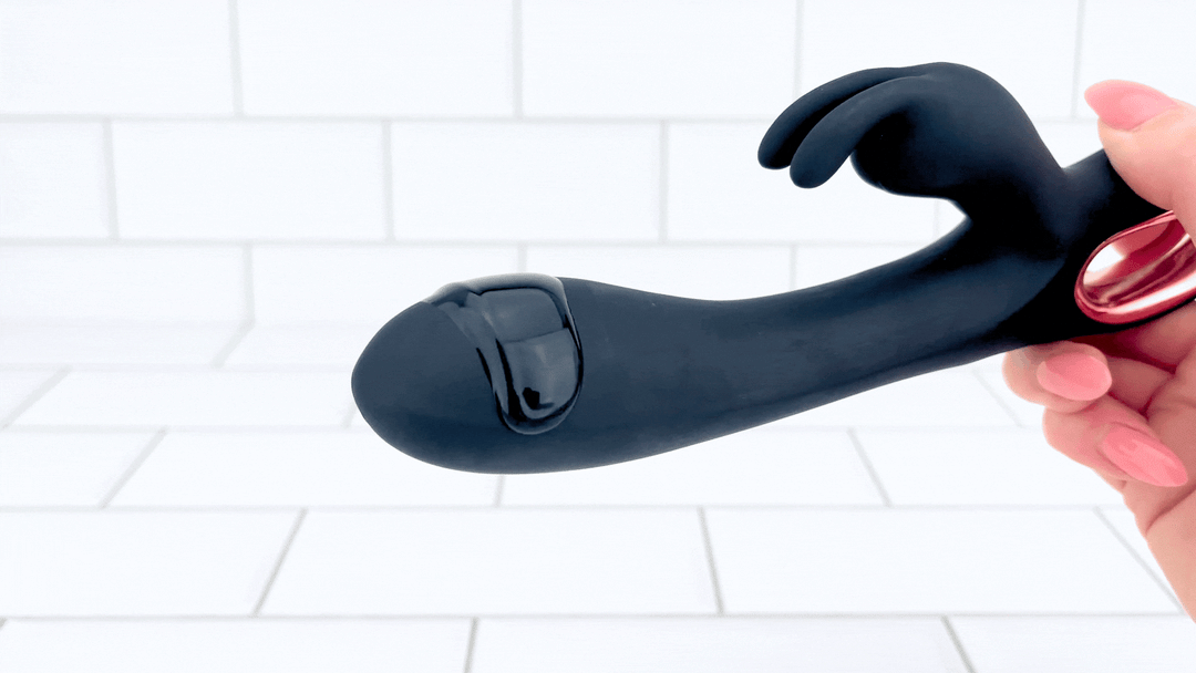 GIF of black silicone rabbit tip vibrating with lube