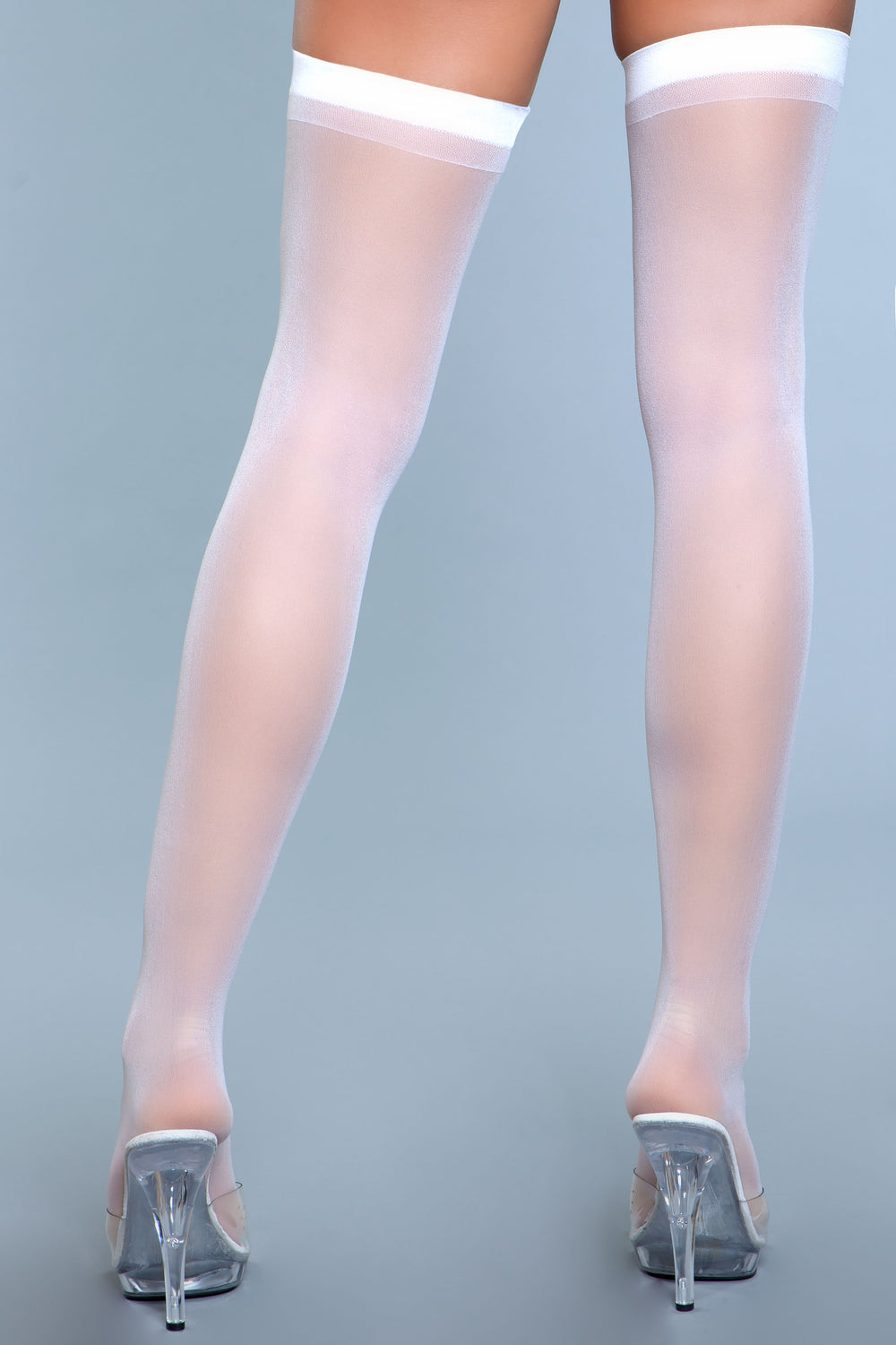 Sheer white thigh highs with band at top facing back