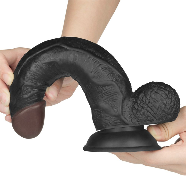 black 8.5 inch dildo being bent to show flexibility 