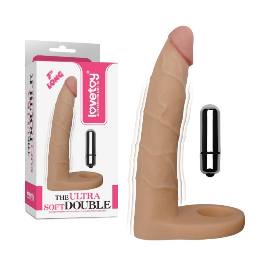 7" Long Ultra Soft Double Penetration Cock Ring as seen next to packaging